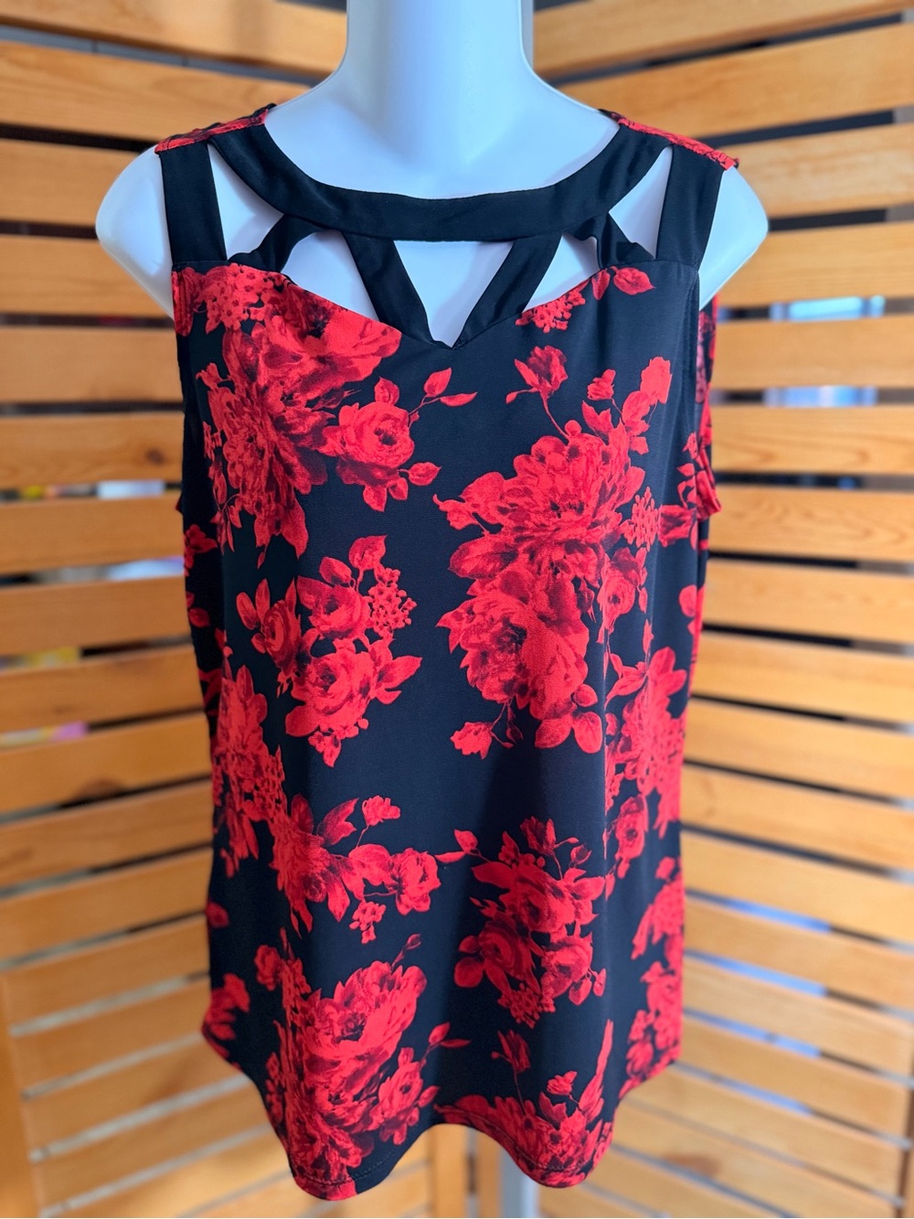 Sleeveless Black Top with Red Floral Print and Cutout Neckline